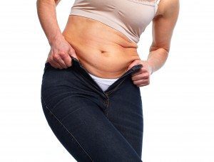 Woman fat belly. Diet and weight loss concept.